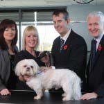 L-R Andrea Warwick, Employment Officer, AMH Accept; Diane McLucas, Proprietor, Barkingham Palace; Edwin Poots MLA, Health Minister; David Babington, CEO, AMH and one satisfied customer who has popped in for a blow dry!