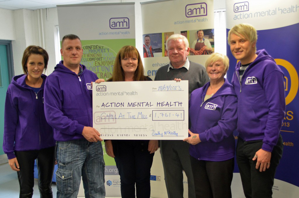 The McKeating family present their donation to clients and staff of AMH