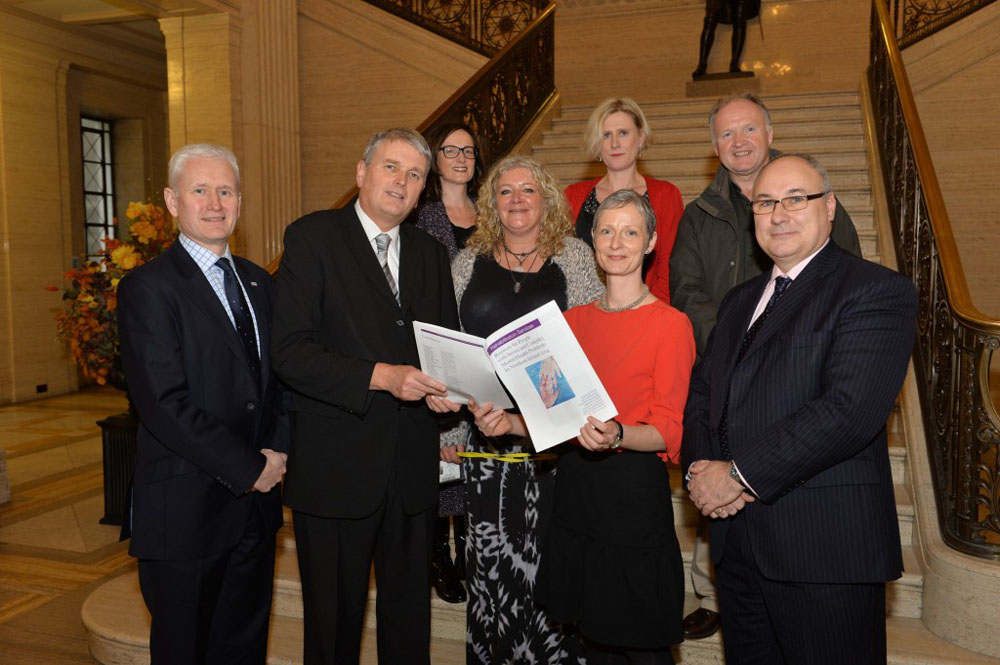 Jim Wells MLA is presented with a copy of the report by Dr Paddy Moynihan, Consultant Psychiatrist. Also pictures representatives from AMH, Cause, Mindwise and Aware Defeat Depression who contributed to the report