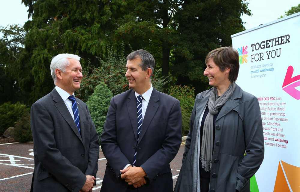 David Babington, Chief Executive of AMH, welcomes Minister Edwin Poots MLA and Julie Harrison, Committee Member from Big Lottery Fund to Together For You’s mental health shared learning event in Cookstown 