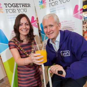 Lord Mayor of Belfast, Nichola Mallon encourages David Babington, Chief Executive of Action Mental Health on the pedal powered smoothie bike!