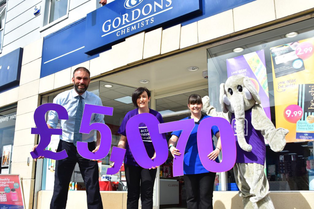 Staff at Gordon's Chemists reveal their amazing fundraising boost to AMH  