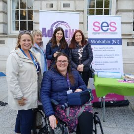 A group of staff and participants from SES Workable (NI) gathered outside Belfast City Hall.