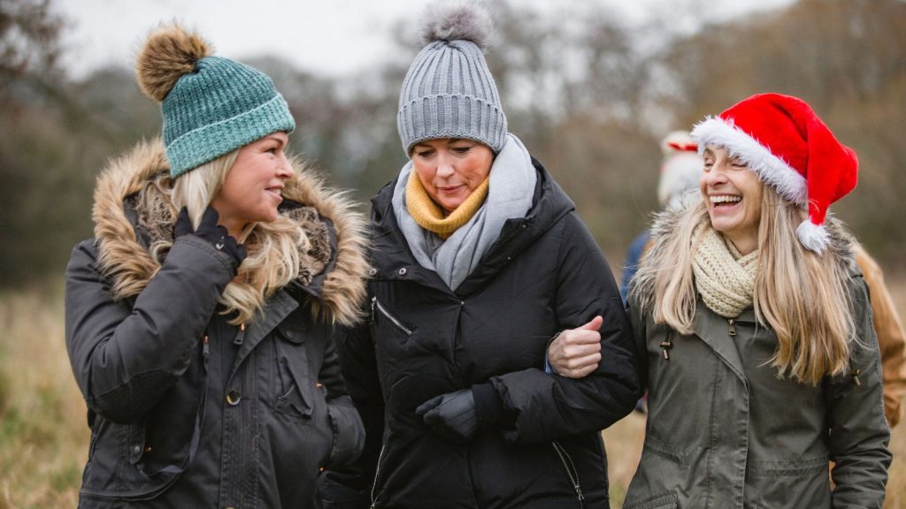 Three friends enjoying a winter walk.
