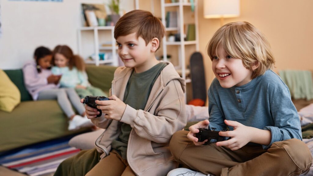 Two boys playing video games together.